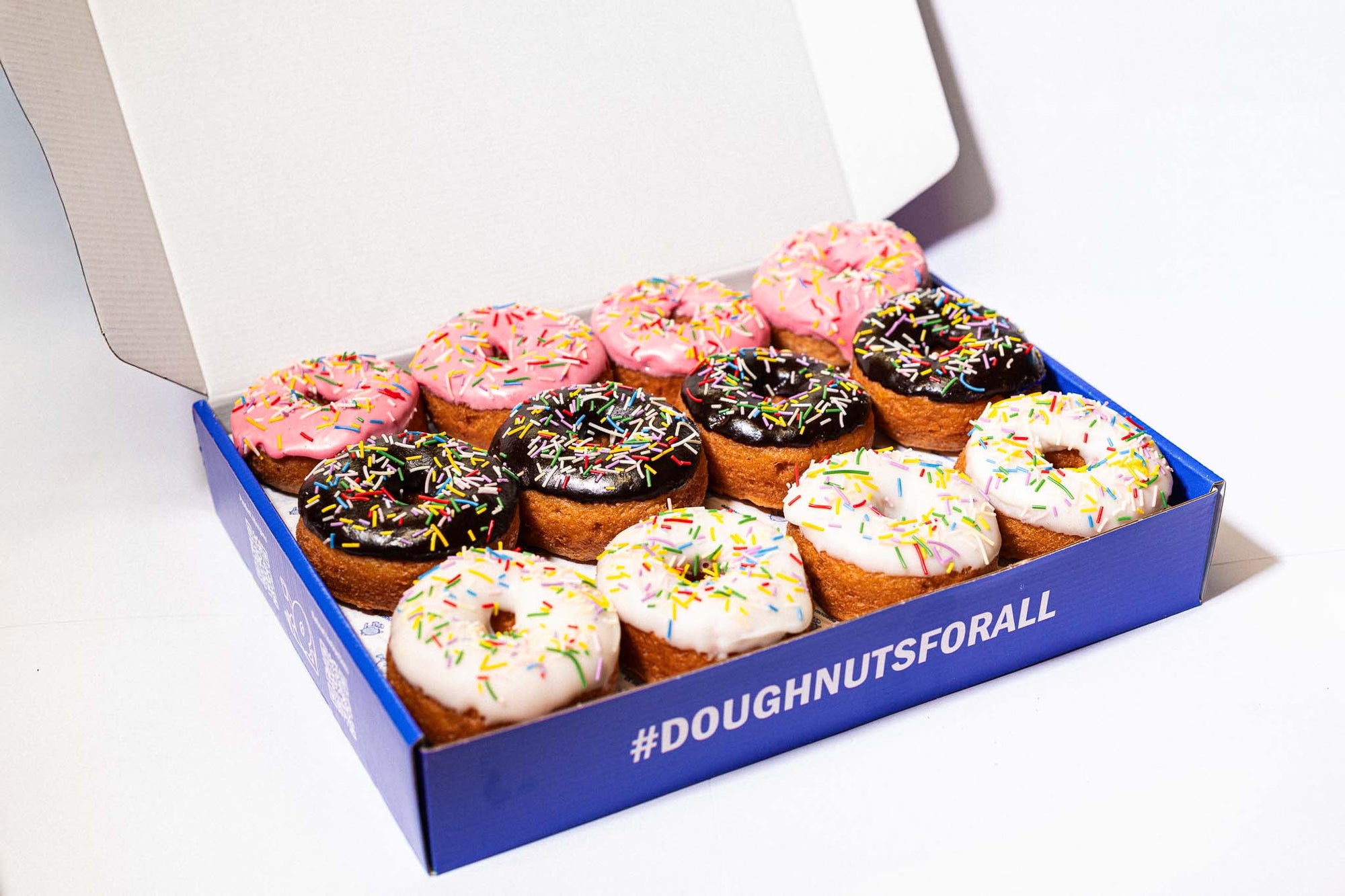 Corporate box of 24 gluten-free, vegan sprinkle doughnuts