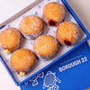 Open Borough 22 box of six gluten free vegan fried sugared filled doughnuts, custard, raspberry jam and chocolate fillings visible at the sides