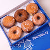 Open Borough 22 box of six gluten free oat free vegan fried doughnuts, sugared custard and jam filled rounds with cinnamon sugar and original glazed rings